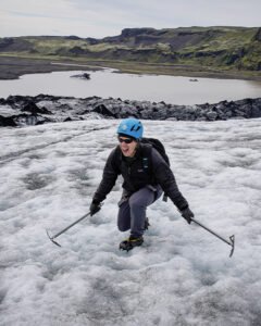 A Man walking on a Glacier in Iceland